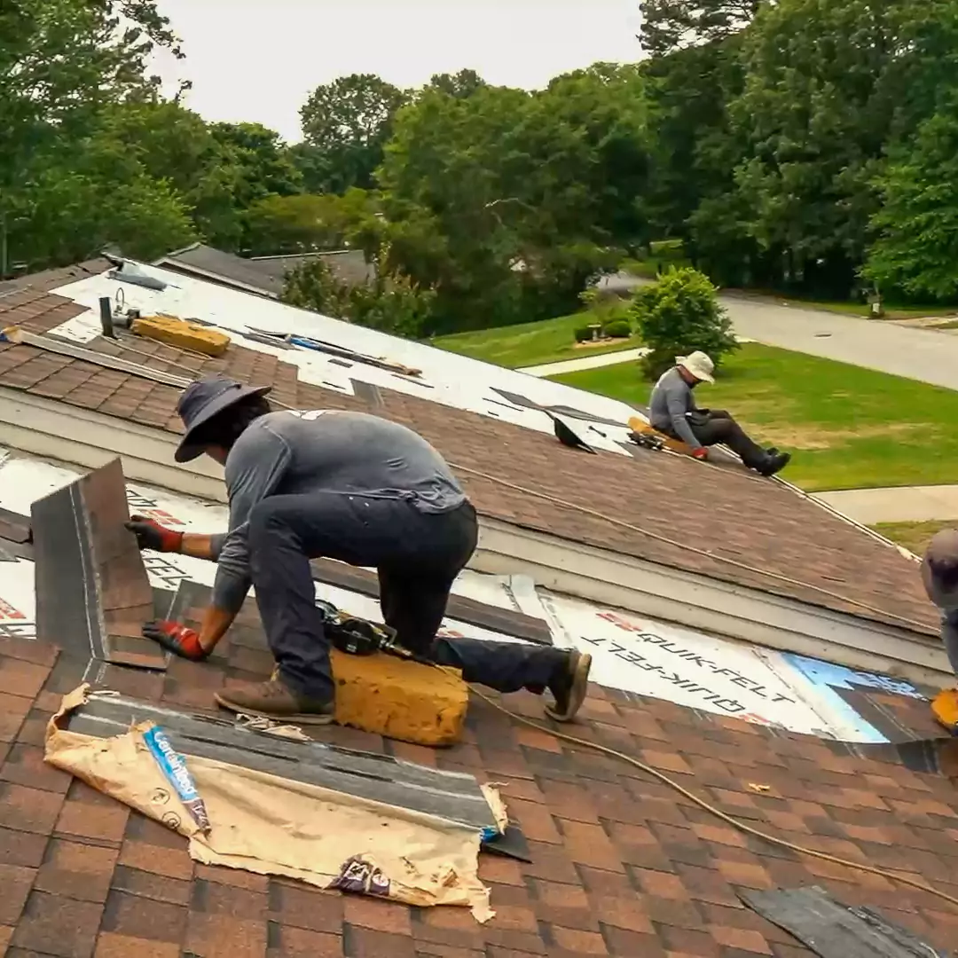 Skilled Generation Roofing crew members in the process of installing new, durable shingles in an Upstate South Carolina residential property.